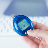 2021 Bandai Virtual Pet Handheld System Tamagotchi Translucent Blue with Yellow Buttons